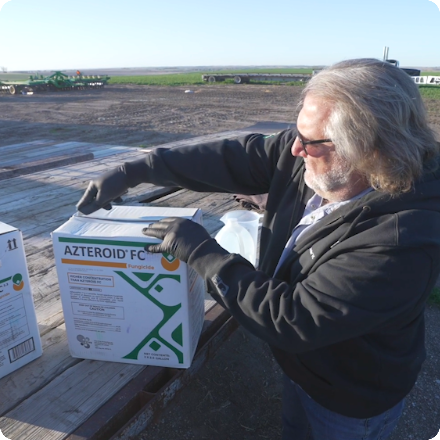 Farmer opening box of AZteroid FC 3.3